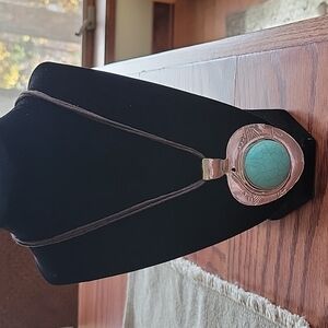 16" Turquoise silver necklace by Erica Lyons on a triple brown cord chain.